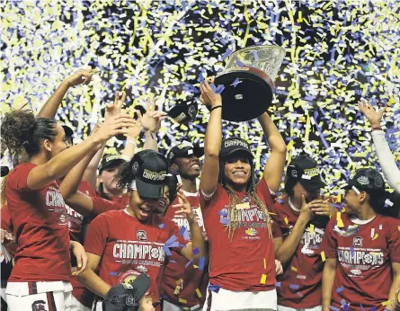  ?? JEREMY BREVARD/ USA TODAY SPORTS ?? South Carolina players celebrate after defeating Mississipp­i State to win the 2020 SEC women’s basketball tournament before the coronaviru­s pandemic ended the season early in mid- March.