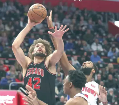  ?? | CARLOS OSORIO/ AP ?? Bulls center Robin Lopez started Saturday against the Pistons and had four points and three rebounds in 17 minutes.