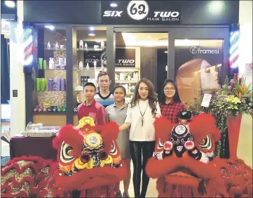  ??  ?? Lim (second right) and staff after the launch and Lion Dance yesterday.