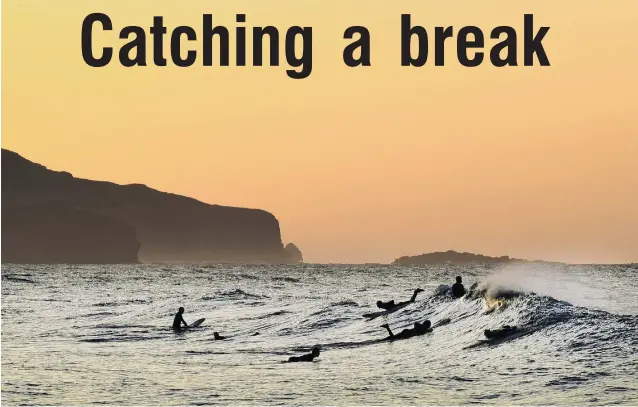  ?? PHOTO: STEPHEN JAQUIERY ?? It’s been a while . . . Surfers were in the water at St Clair before sunrise yesterday.