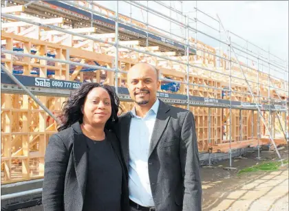  ?? PHOTO / DAVID HAXTON ?? Audrey and Roland Lotsu in front of constructi­on of the new St Joseph Skin Cancer Clinic.