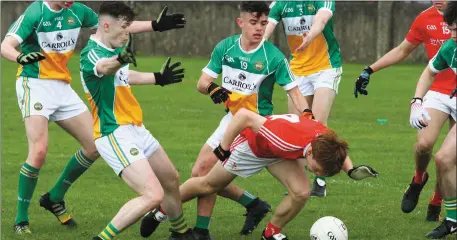  ?? Picture: Shane Maguire ?? Louth’s Ciaran Keenan emerges from an Offaly ruck during Saturday’s Leinster MFC quarter-final in Drogheda.