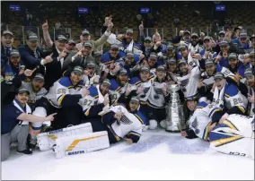  ?? MICHAEL DWYER - THE ASSOCIATED PRESS ?? FILE - In this June 12, 2019, file photo, the St. Louis Blues celebrate with the Stanley Cup after they defeated the Boston Bruins in Game 7 of the NHL Stanley Cup Final in Boston.