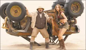  ?? Frank Masi / Associated Press ?? This image released by Sony shows Jack Black, left, and Karen Gillan in a scene from “Jumanji: The Next Level.”