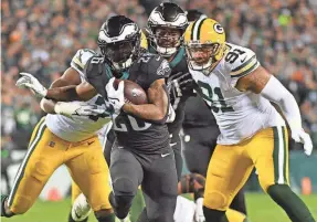  ?? ERIC HARTLINE/USA TODAY SPORTS ?? Miles Sanders rushed for 143 yards and two touchdowns in the Eagles’ 40-33 win Sunday night over the Packers.