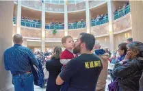  ?? EDDIE MOORE/JOURNAL ?? Gabriel Gacia, from Albuquerqu­e, kisses his son Elias during the annual “Sanctity of Life Awareness and Unity Day” rally in the Rotunda of the Roundhouse on Jan. 22, 2020.