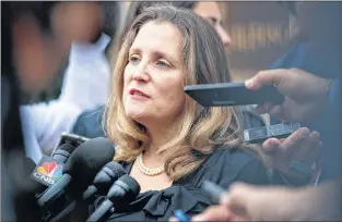  ?? AP PHOTO ?? Canadian Foreign Affairs Minister Chrystia Freeland speaks to the media as she arrives at the Office of the United States Trade Representa­tive Tuesday in Washington.