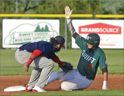  ?? STEVEN MAH/SOUTHWEST BOOSTER ?? Swift Current 57’s outfielder Toren Brozovich (right) slid in for a stolen base ahead of the tag of Regina’s
Ivan Nunez during a 3-0 win last week.