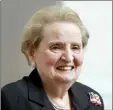  ?? AP file photo ?? Former U.S. Secretary of State Madeleine Albright smiles at the Smithsonia­n National Museum of American History in Washington in this May 24, 2012 photo. Albright — the first woman to hold the job of U.S. Secretary of State — died last month at age 84.
President Joe Biden (left), talks with former President Barack Obama and former first lady Michelle Obama, before the start of the funeral service for former Secretary of State Madeleine Albright at the Washington National Cathedral on Wednesday in Washington. Former President Bill Clinton and former Secretary of State Hillary Clinton are right.