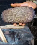  ??  ?? BRUTAL: Stones such as this are heated and used for breast-ironing