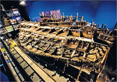  ??  ?? The hull of the Mary Rose at the Historic Dockyard in Portsmouth. Left, the Diamond Light Source synchrotro­n. Above left, a 16th century illustrati­on of the ship.