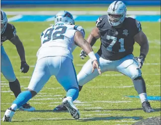  ?? Brian Westerholt The Associated Press ?? Denzelle Good prepares to block Panthers defensive tackle Zach Kerr in the Raiders’ opener last Sunday. Good, a reserve guard, had to play tackle after the top two guys at the position were injured.