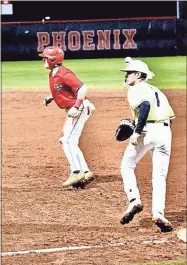  ?? Barbara hall ?? A Sonoravill­e baserunner takes a big lead at first base against Calhoun last Friday night at The Furnace. The Phoenix rallied late for a 3-2 win over the Yellow Jackets.