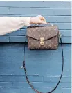  ?? Unsplash ?? A LOUIS Vuitton crossbody bag.
|