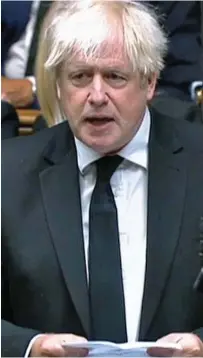  ?? ?? Touching eulogy: Boris Johnson yesterday and, above, a minute’s silence in the Commons