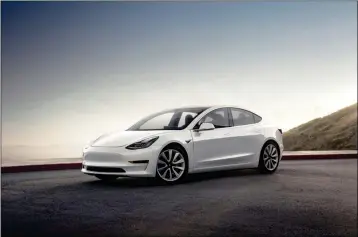  ?? COURTESY OF TESLA VIA AP ?? THIS UNDATED PHOTO PROVIDED by Tesla shows the Tesla Model 3, which the automaker has touted as its most affordable electric vehicle. Tesla is only building rear-wheel-drive Model 3 sedans with the expensive 310-mile long-range battery at the moment....