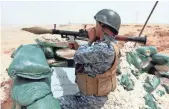  ?? ALAA AL-SHEMAREE, EUROPEAN PRESSPHOTO AGENCY ?? An Iraqi soldier holds a grenade launcher in an operation against the Islamic State near Ramadi on June 1.