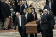  ?? AP PHOTO/ MATT ROURKE, FILE ?? FILE - In this Oct. 30, 2018, file photo, a casket is carried out of Rodef Shalom Congregati­on after the funeral services for brothers Cecil and David Rosenthal, in Pittsburgh. The brothers were killed in the mass shooting last week at the Tree of Life synagogue. A team of rabbis and volunteers has gone into the Tree of Life synagogue to gather up blood and other remains from the victims of the shooting rampage, in keeping with Jewish law that says the entire body must be buried.