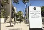  ?? AP photo ?? A sign for the Prince Jonah Kuhio Kalanianao­le Federal Building and Courthouse is displayed outside the courthouse on Monday, in Honolulu. A trial underway at the U.S. courthouse is providing a possible glimpse into Hawaii’s underworld.
