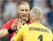  ?? AP ?? Denmark goalkeeper Kasper Schmeichel (right) speaks to referee Nestor Pitana. —