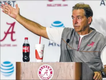  ?? THE ASSOCIATED PRESS ?? Alabama football coach Nick Saban talks with the media following a scrimmage on Aug. 19 at Bryant-Denny Stadium in Tuscaloosa, Ala. The Tide is ranked No. 1 in the Associated Press preseason poll.