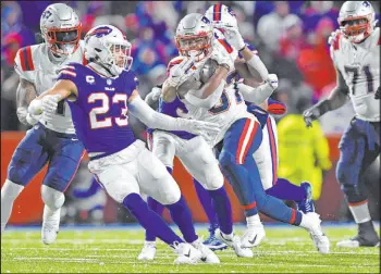  ?? Adrian Kraus The Associated Press ?? Damien Harris and the Patriots’ rushing attack beat the Bills in their “Monday Night Football” game on Dec. 6.