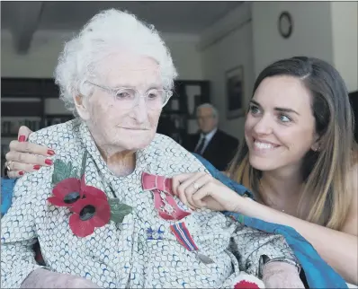  ?? PICTURE: PA WIRE. ?? PROUD DAY: Britain’s longest-serving poppy seller, 103-year-old Rosemary Powell, with grand daughter Celia Speller.