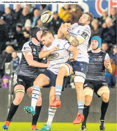  ??  ?? > Action from the pre-Christmas derby between Cardiff Blues and Ospreys