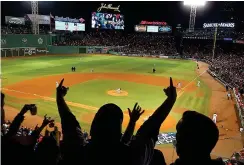 ??  ?? Bostonians love their sport... Left, The Red Sox host the LA Dodgers in Game Two of the World Series at Fenway Park in October 2018