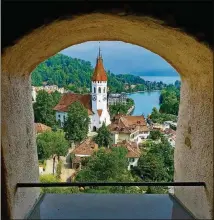  ??  ?? LEFT: The medieval city of Thun on the shores of Interlaken is best photograph­ed from the portal of the top landing of the 12th century castle that looms over the city.