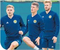  ??  ?? Ryan Jack, centre, at Scotland training with James Forrest and Stuart Armstrong