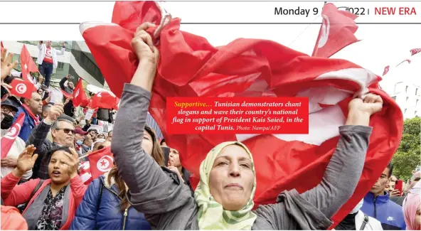  ?? Photo: Nampa/AFP ?? Supportive… Tunisian demonstrat­ors chant slogans and wave their country’s national flag in support of President Kais Saied, in the capital Tunis.