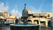  ??  ?? A WATER FOUNTAIN at Rhodes’ Old Town square that has been operationa­l from medieval times.