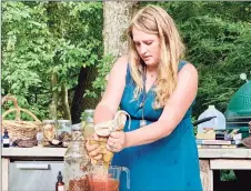  ?? Elyse Sadtler / For Hearst Connecticu­t Media ?? Lecturer Tanya Donatelli strains a batch of mushrooms in a Plant Wisdom program hosted at Twin Star in New Milford.