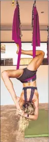  ?? SUBMITTED PHOTO/EMMA QUANN FLAVELL ?? Emma Quann Flavell holds a pose during her aerial yoga certificat­ion.