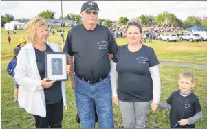  ?? CHRISTIAN ROACH/CAPE BRETON POST ?? From left, Sharon McNeil, her husband Tom McNeil, their daughter Shuana Rau and her son Sam Rau. Tom McNeil lost his grandfathe­r, great-grandfathe­r and great-uncle in the mine explosion at No. 12 Colliery 100 years ago. The family travelled from Ontario to be at the ceremony rememberin­g 65 miners who lost their lives.