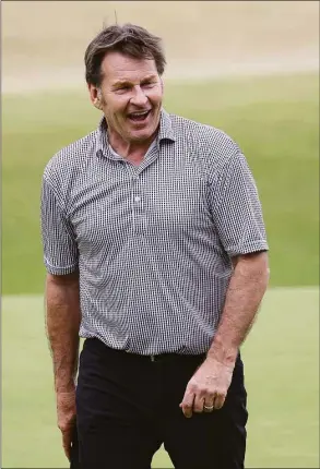  ?? Harry How / Getty Images ?? Nick Faldo walks a fairway during July’s British Open. Faldo, CBS’ lead golf analyst, signed off Sunday after 16 years in the booth.