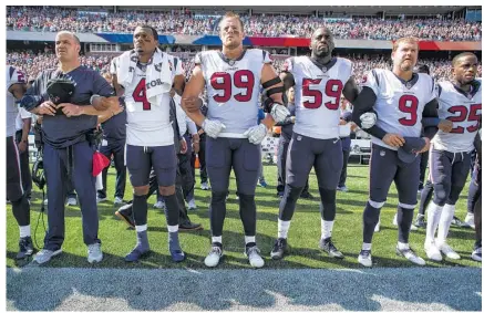 ?? Brett Coomer / Houston Chronicle ?? Texans coach Bill O’Brien, left, lines up with his players Sunday as they lock arms in a show of solidarity before their game against the New England Patriots in Foxborough, Mass. The scene was repeated at NFL games across the country.