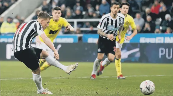  ??  ?? Matt Ritchie scores from the spot to secure a replay at Blackburn.