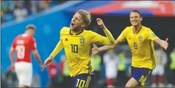  ?? The Associated Press ?? EMIL DELIVERS: Sweden’s Emil Forsberg celebrates the only goal in a 1-0 victory over Switzerlan­d Tuesday in a round of 16 match at the 2018 FIFA World Cup in St. Petersburg, Russia.