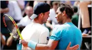  ??  ?? AP PHOTO BY ALESSANDRA TARANTINO Spain’s Rafael Nadal, right, hugs Germany’s Maximilian Marterer after their fourth match of the French Open tennis tournament at the Roland Garros stadium, Monday, June 4,in Paris. Nadal won 6-3, 6-2, 7-6 (4).