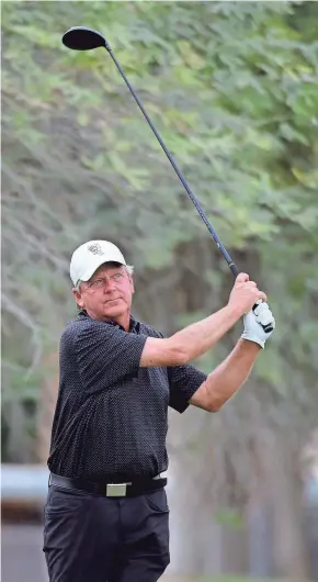  ?? STEVE DYKES/GETTY IMAGES ?? Mark Brooks hits his tee shot on the fourth hole during the first round of the Charles Schwab Cup Championsh­ip in 2020.