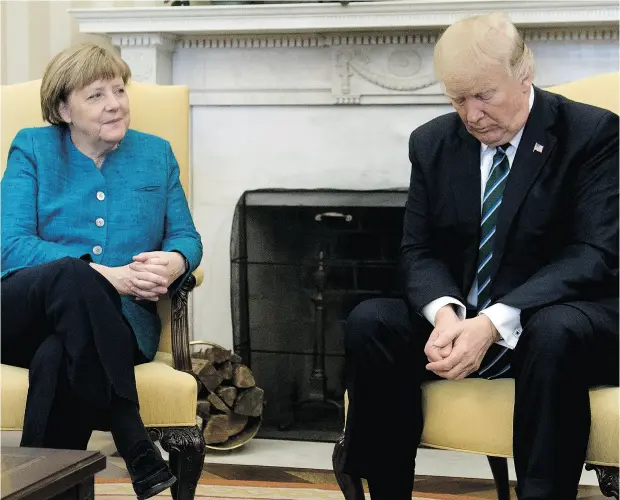  ?? SAUL LOEB / AFP / GETTY IMAGES ?? German Chancellor Angela Merkel and U. S. President Donald Trump had a somewhat awkward meeting at the White House Friday.