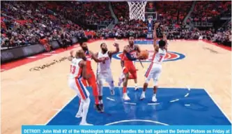  ??  ?? DETROIT: John Wall #2 of the Washington Wizards handles the ball against the Detroit Pistons on Friday at Little Caesars Arena in Detroit, Michigan. — AFP