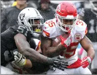  ?? JOHN SLEEZER/TRIBUNE NEWS SERVICE ?? Kansas City Chiefs running back Charcandri­ck West runs into Oakland Raiders outside linebacker Bruce Irvin on Oct. 16, 2016 in Oakland.