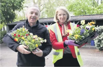  ??  ?? Andy Hopkins and Judie Hodsdon at the Friends of Pittville plant sale which raised funds towards improving the park’s green spaces Pictures: Rosemary Watts