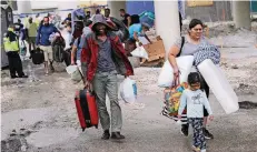 ?? FOTO: DPA ?? Menschen in Miami auf der Flucht vor dem Hurrikan.
