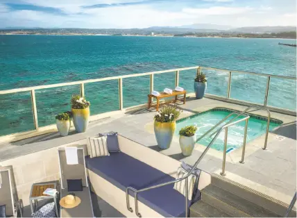  ?? Monterey Plaza Hotel and Spa ?? A spa and hot tub overlook the ocean, top, and a fire pit (left) invites guests to gather on cool evenings at the Monterey Plaza Hotel & Spa, above.