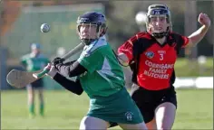  ??  ?? Ciara Murphy (Cloughbawn) under pressure from Katie Roche.