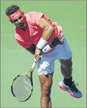  ?? JASON DECROW / ASSOCIATED PRESS ?? Rafael Nadal follows through on a serve during his 6-2, 6-4, 6-1 victory over Alexandr Dolgopolov as he advances to the quarterfin­als.